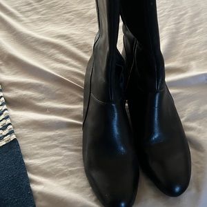 Tall, wedge style boots.